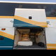 Image for article titled This Beautiful Coach Bus RV Has A Basement Bedroom And A Full Kitchen